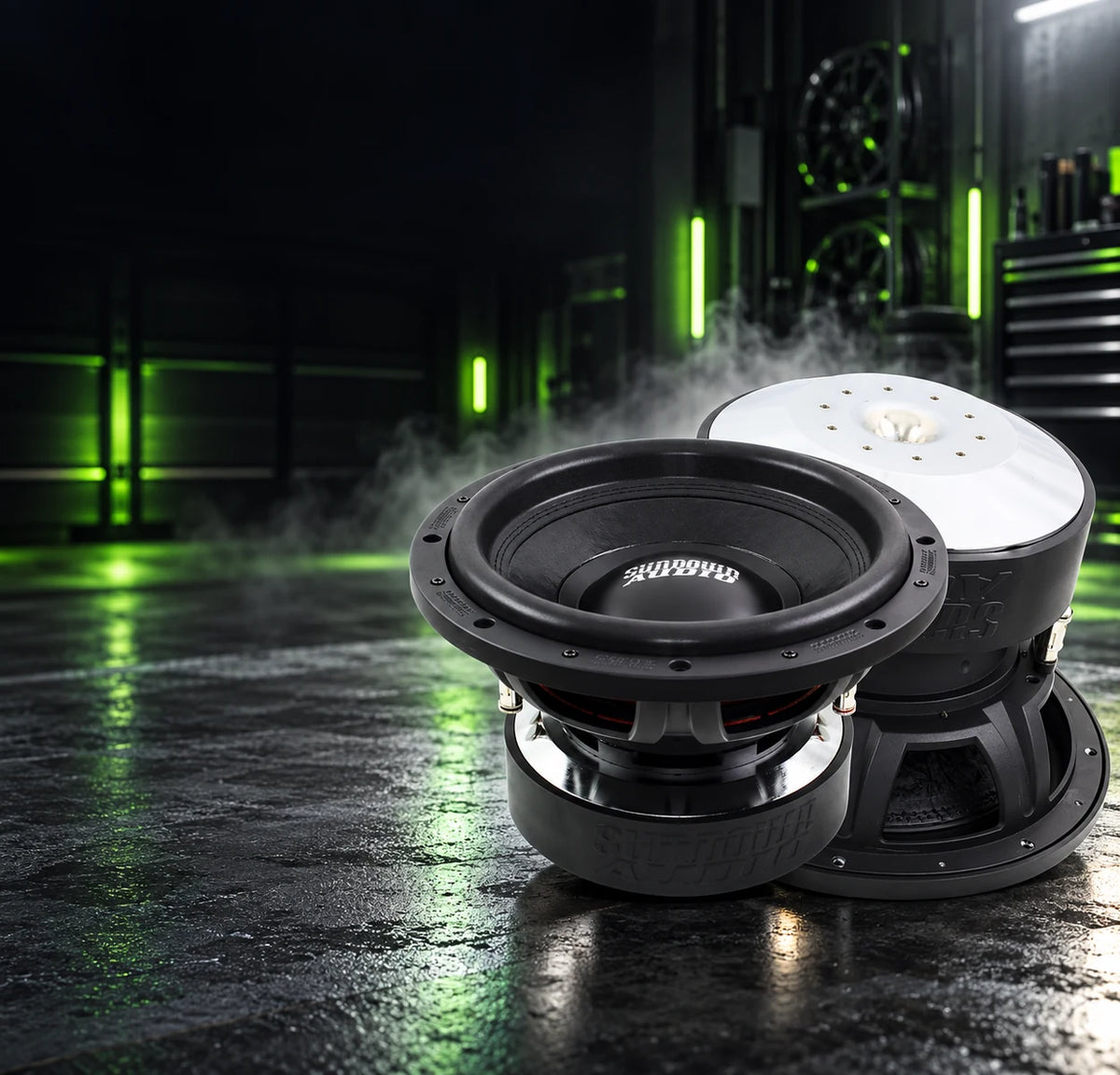 Refurbished Sundown Audio subwoofers in a dark workshop. More bass, less spend. Shop refurbished gear.